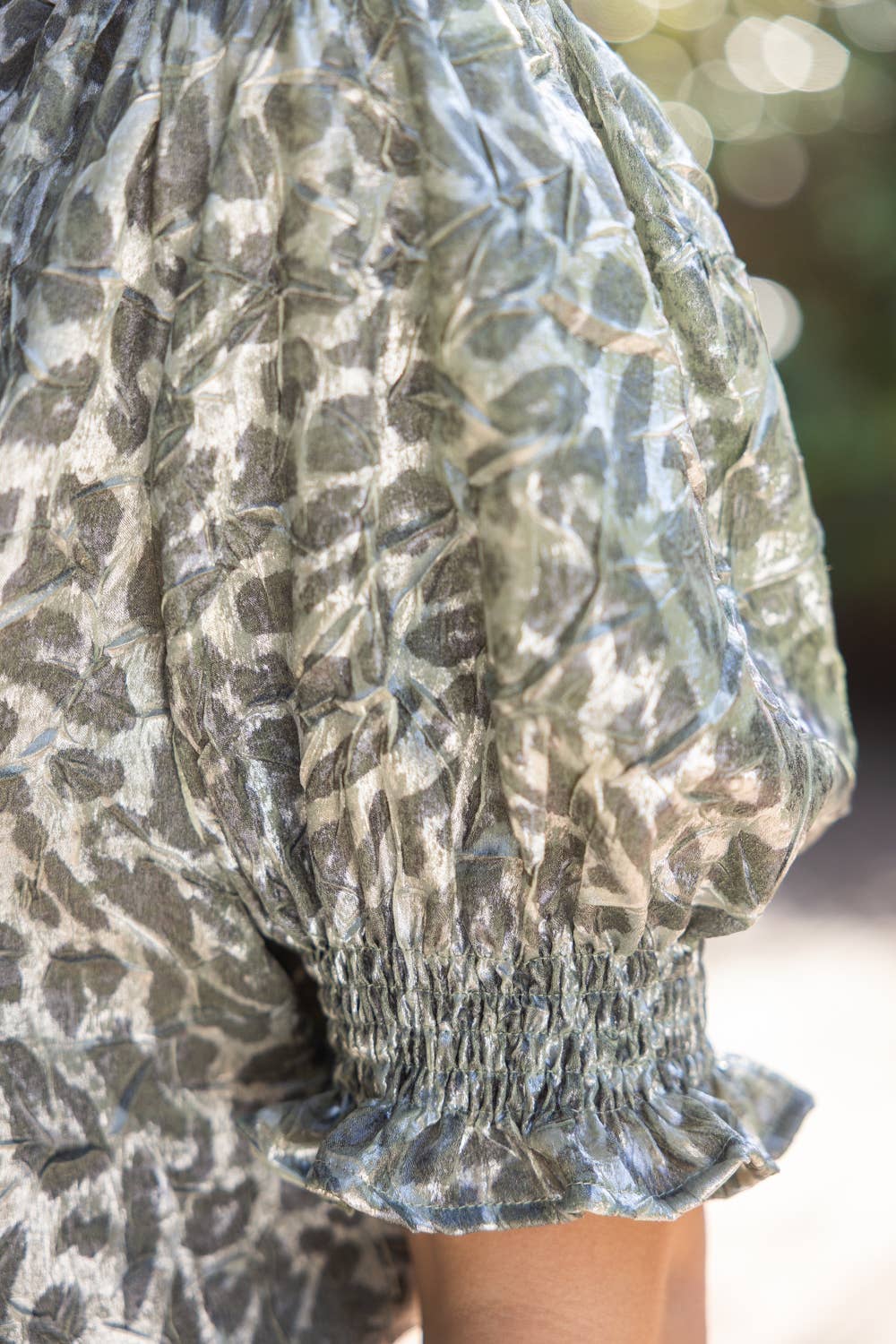 Smocked Short Sleeve V-Neck Animal Print Top