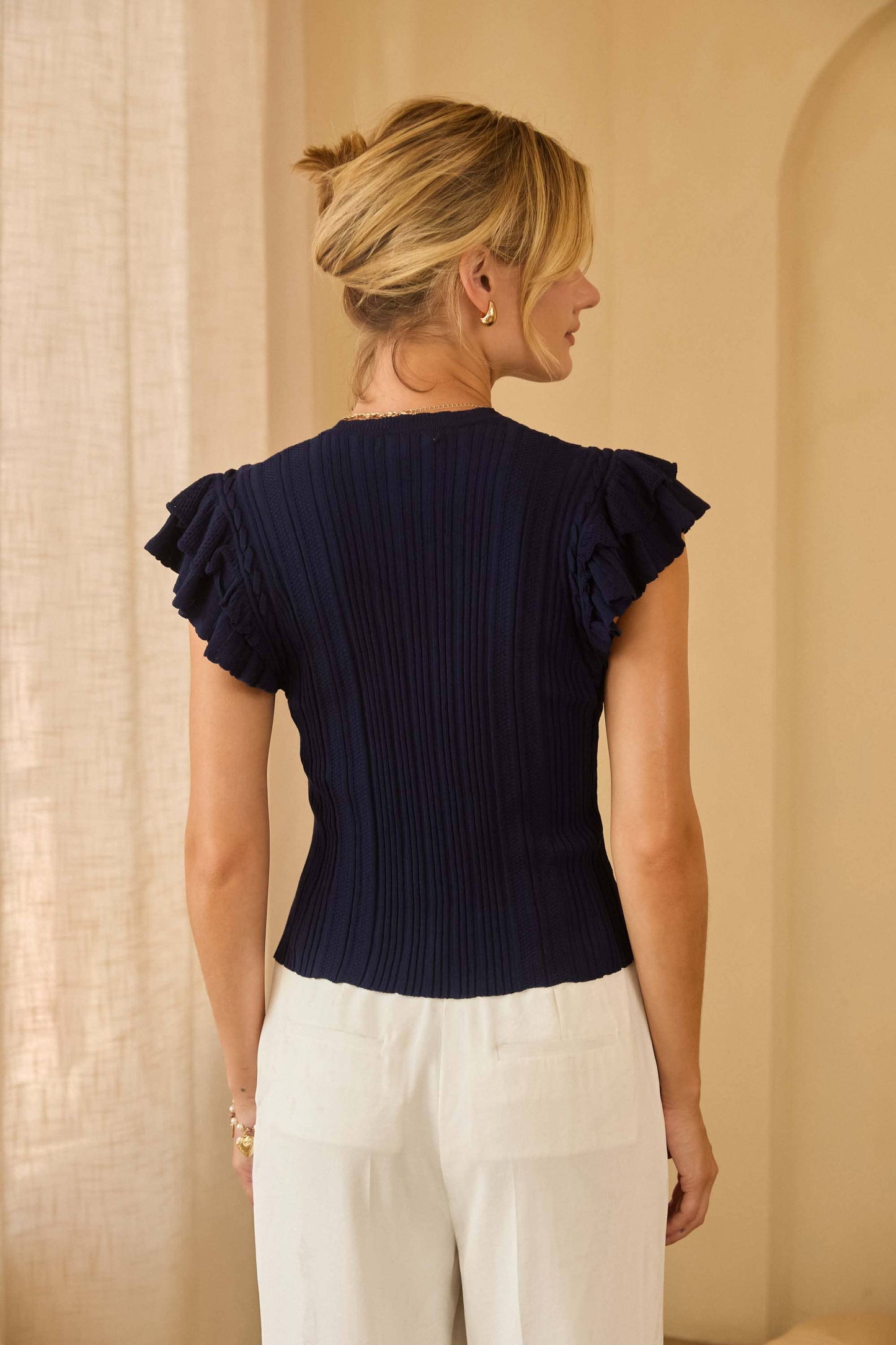 Ruffled Sleeveless Ribbed Knit Top